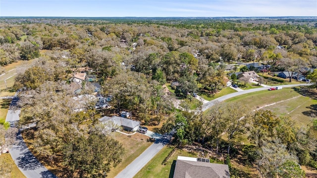 drone / aerial view featuring a forest view