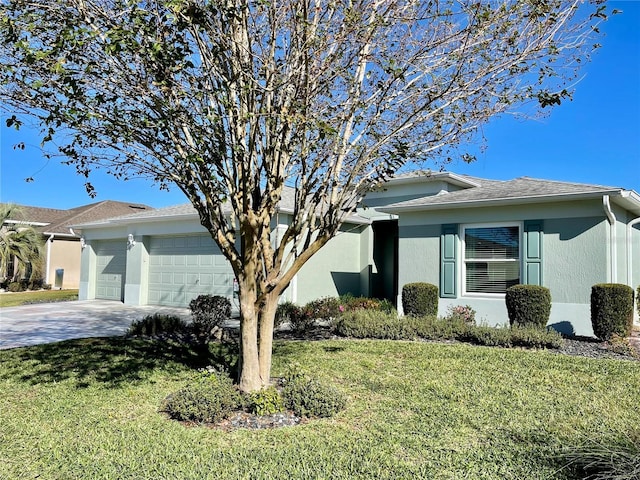 single story home with a front yard and a garage