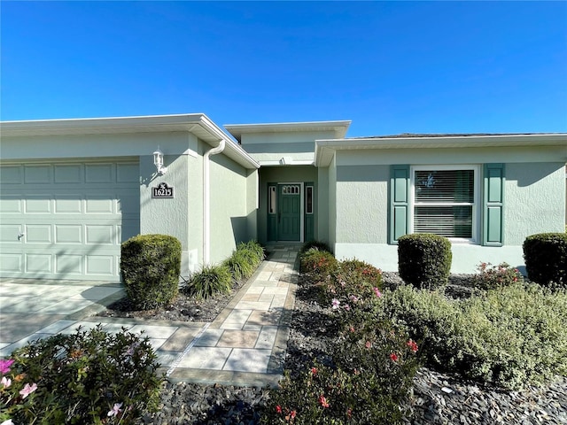 view of exterior entry with a garage