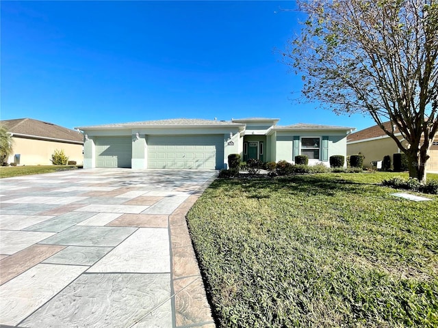 single story home featuring a garage and a front yard