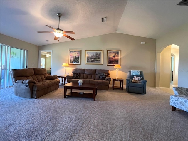 living room with carpet, ceiling fan, and vaulted ceiling