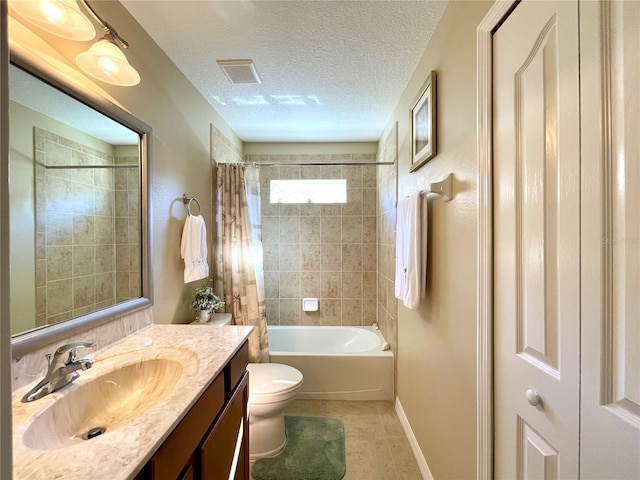 full bathroom featuring vanity, tile patterned flooring, toilet, shower / bath combo with shower curtain, and a textured ceiling