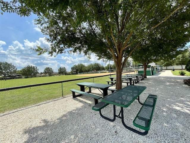 view of property's community featuring a yard