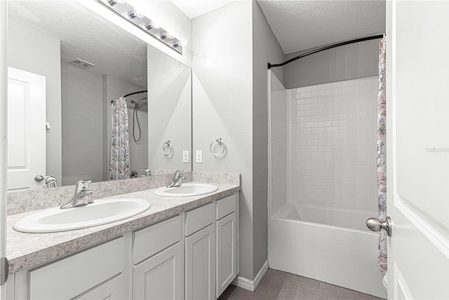 bathroom featuring vanity, a textured ceiling, tile patterned floors, and shower / bathtub combination with curtain