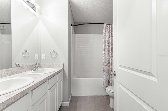 full bathroom with vanity, a textured ceiling, shower / bathtub combination with curtain, tile patterned flooring, and toilet