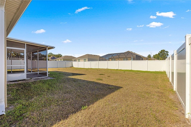 view of yard featuring a sunroom