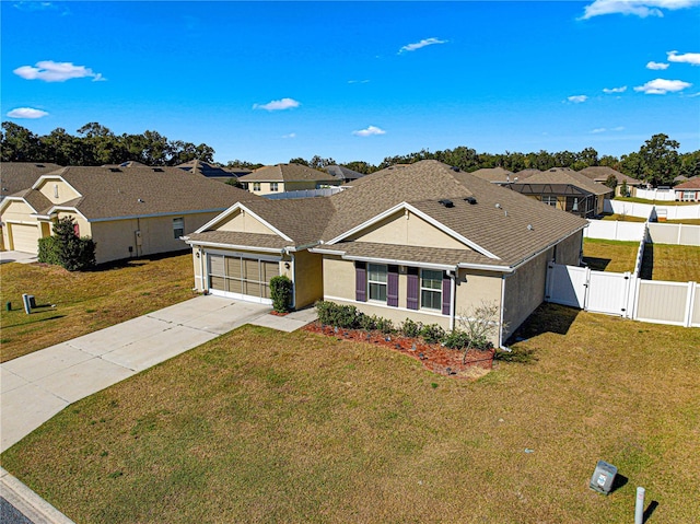 single story home featuring a front yard and a garage