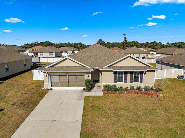 view of front facade featuring a front yard and a garage