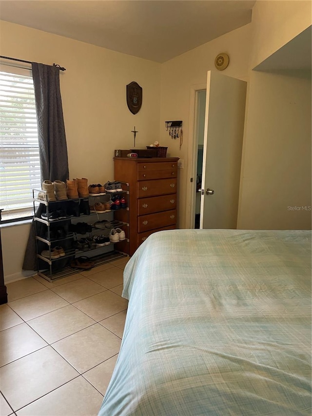 bedroom with light tile patterned flooring