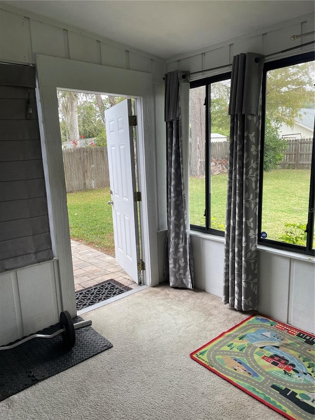 doorway with carpet floors