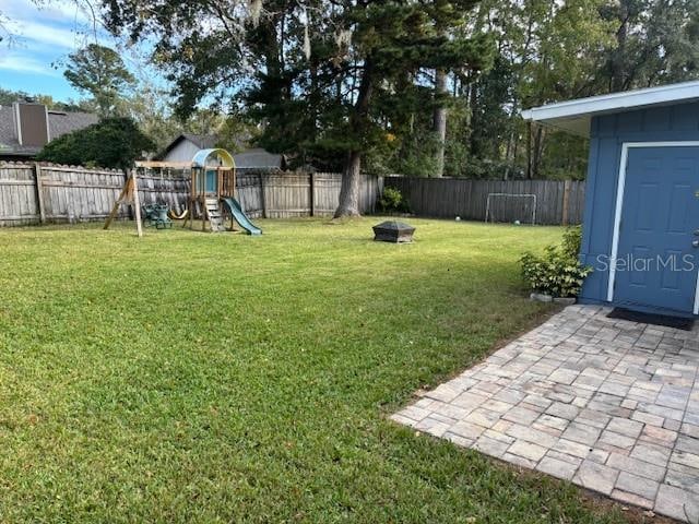 view of yard featuring a playground