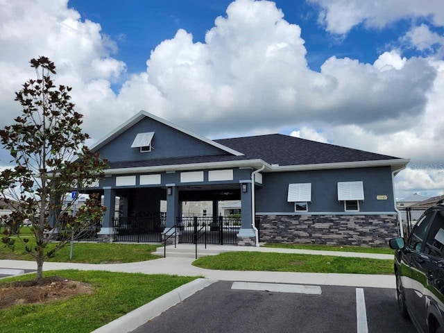 view of building exterior with uncovered parking