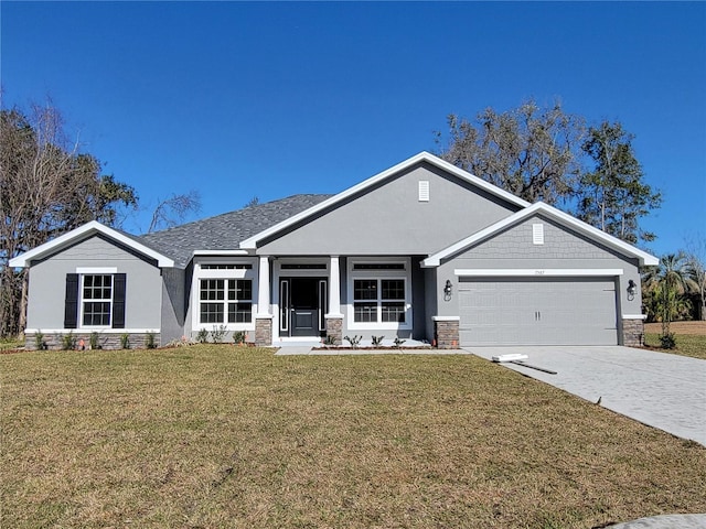 view of front facade with a front yard and a garage