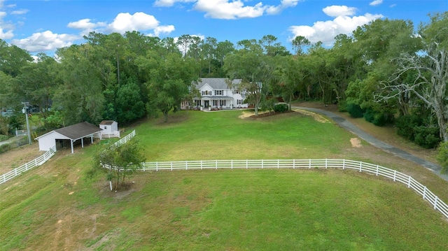 birds eye view of property with a rural view