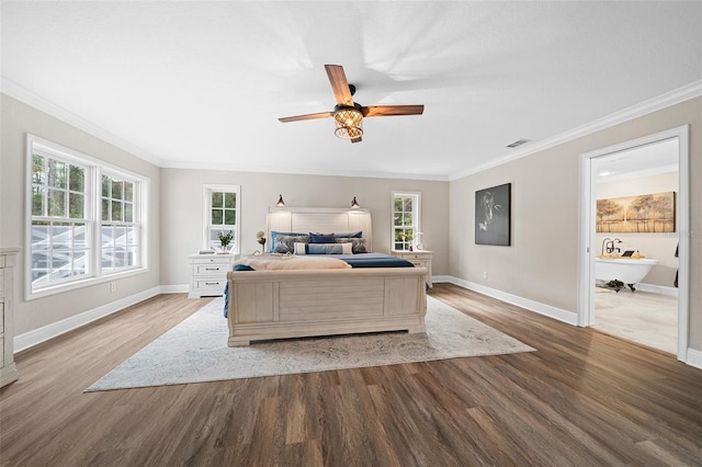 bedroom with baseboards, wood finished floors, and crown molding