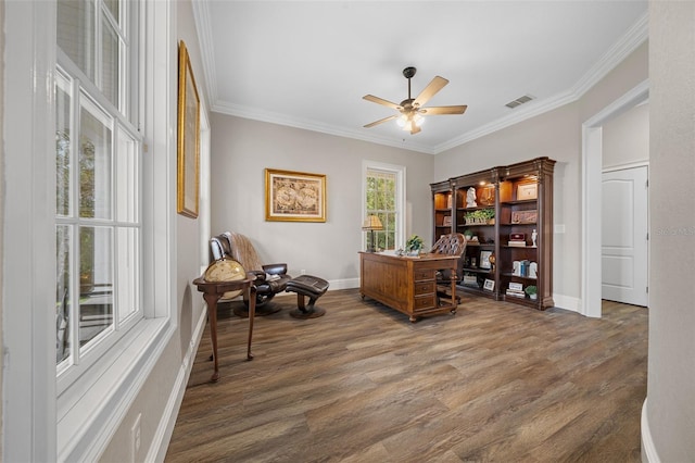 home office with ceiling fan, wood finished floors, visible vents, and ornamental molding