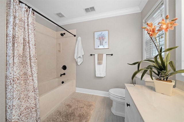 bathroom featuring visible vents, toilet, and crown molding