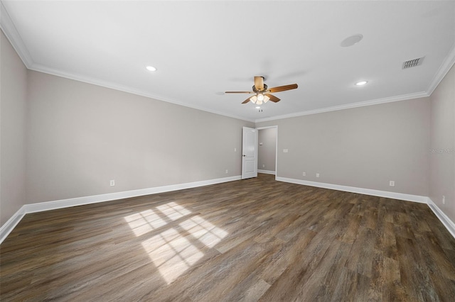 unfurnished room with visible vents, ornamental molding, baseboards, and dark wood-style flooring