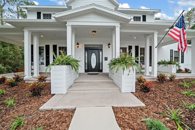 doorway to property with covered porch