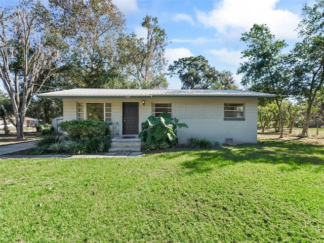 ranch-style house with a front lawn