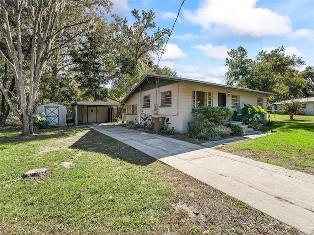 view of front facade with a shed and a front yard