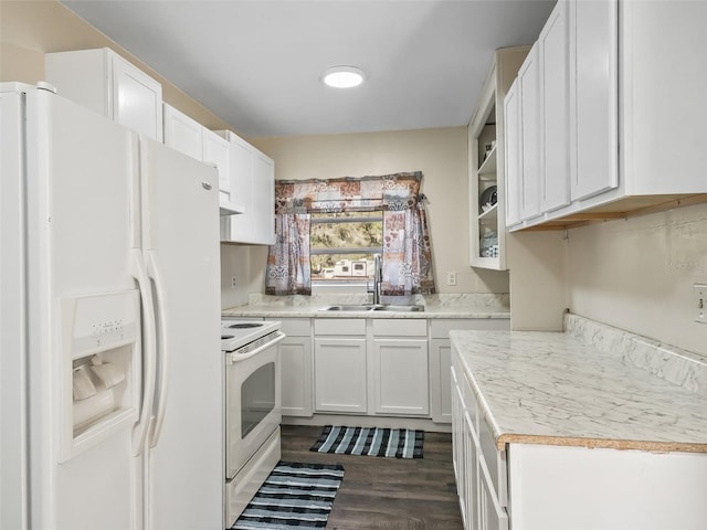 kitchen featuring dark hardwood / wood-style floors, white cabinetry, white appliances, and sink