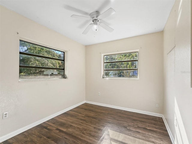 empty room featuring dark hardwood / wood-style floors and ceiling fan