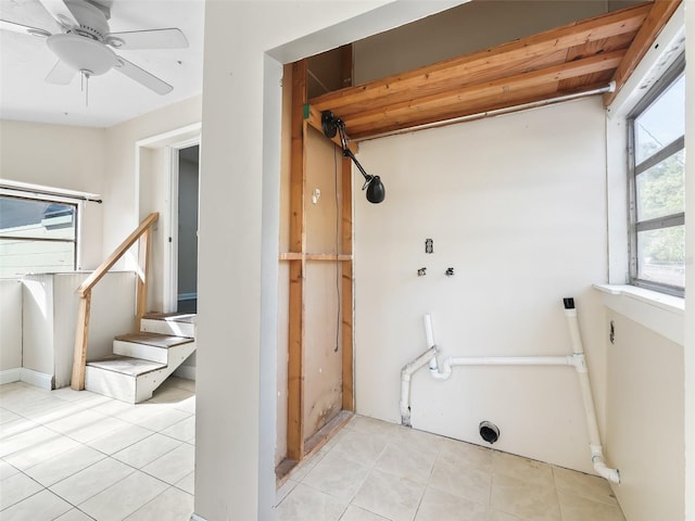 laundry room with light tile patterned floors and ceiling fan