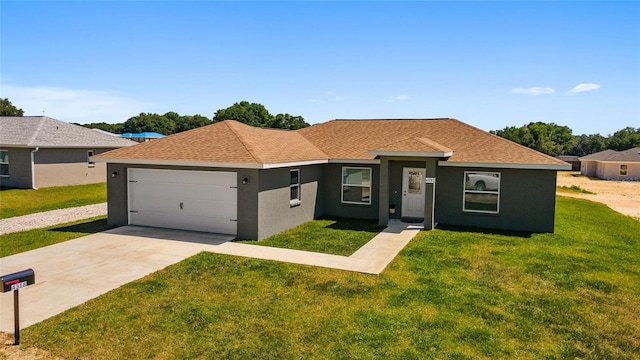 ranch-style home with a front yard and a garage