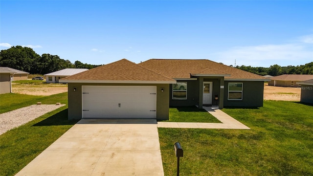 single story home featuring a garage and a front lawn