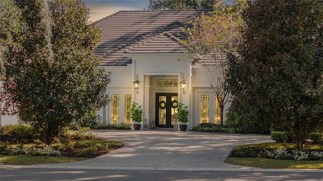 exterior entry at dusk with french doors