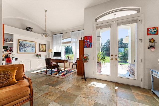 doorway featuring french doors and vaulted ceiling