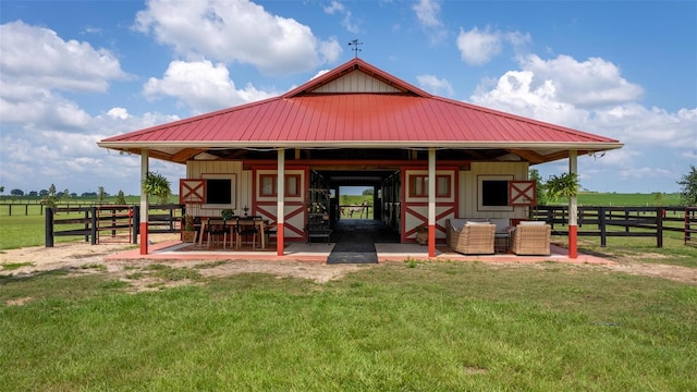 exterior space with an outbuilding and a rural view