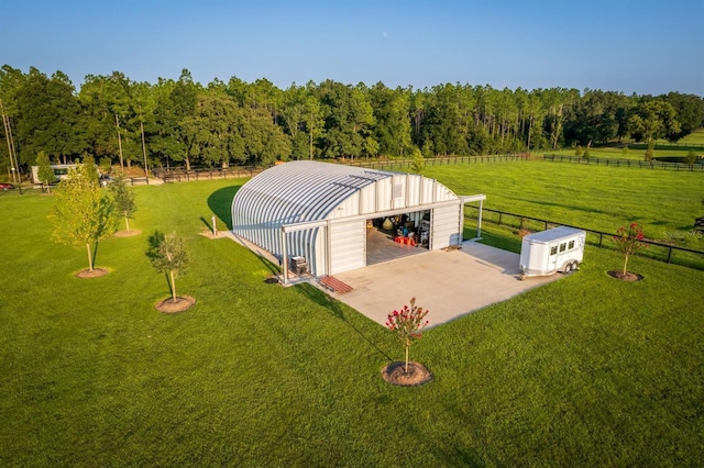 birds eye view of property with a rural view