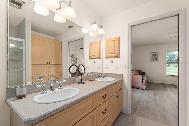 bathroom with vanity and wood-type flooring