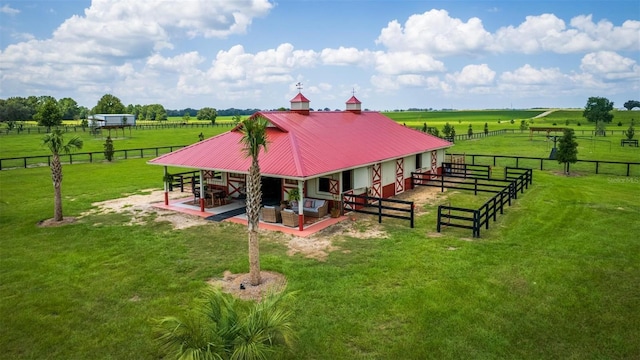 exterior space with a rural view and an outdoor structure