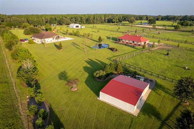 birds eye view of property with a rural view