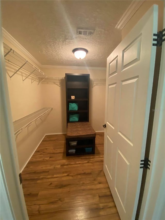 spacious closet with hardwood / wood-style floors