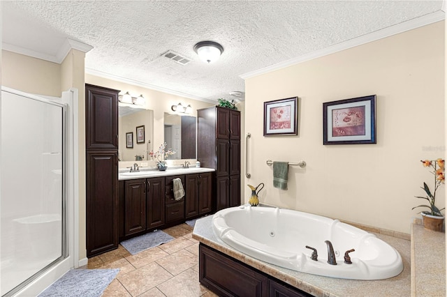 bathroom with vanity, tile patterned floors, crown molding, shower with separate bathtub, and a textured ceiling