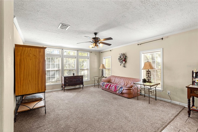 carpeted living room with a wealth of natural light and ornamental molding