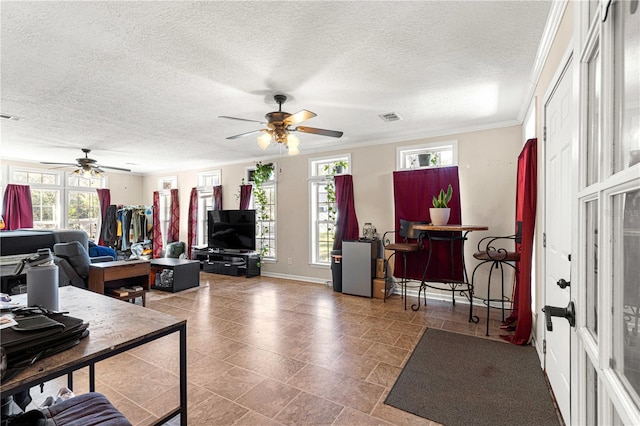 home office featuring a textured ceiling, plenty of natural light, and crown molding