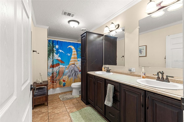 full bathroom with vanity, tile patterned floors, crown molding, toilet, and a textured ceiling