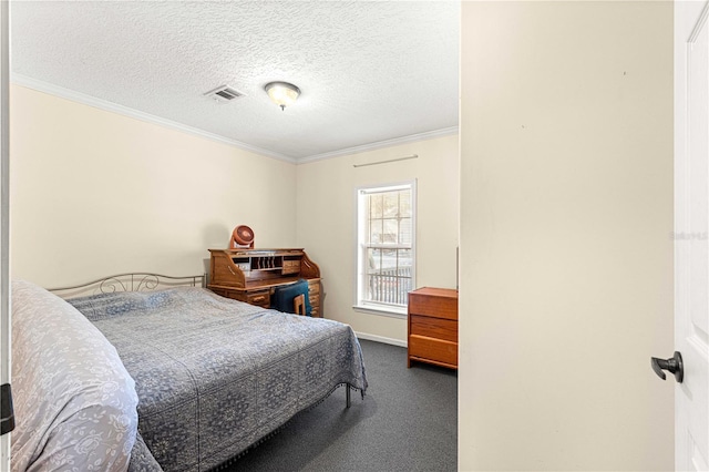 bedroom featuring a textured ceiling, carpet floors, and crown molding