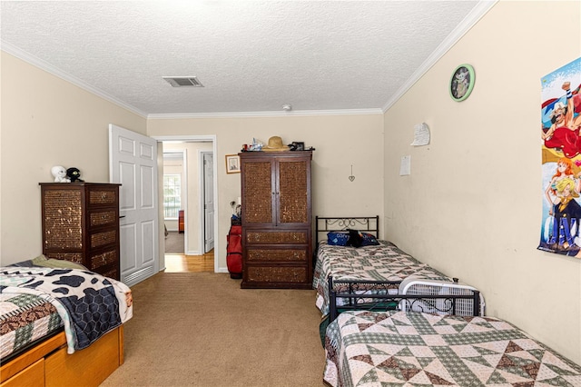 carpeted bedroom with a textured ceiling and ornamental molding