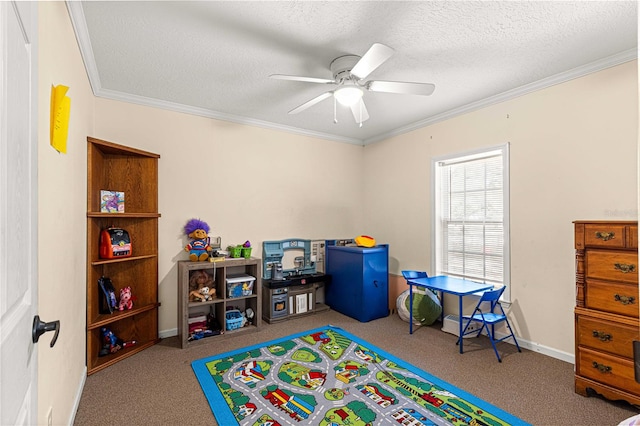 playroom with ceiling fan, crown molding, light colored carpet, and a textured ceiling