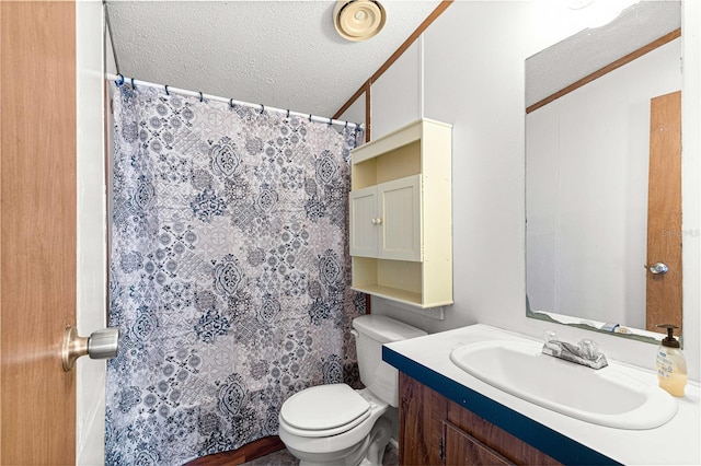 bathroom featuring ornamental molding, vanity, a textured ceiling, toilet, and lofted ceiling