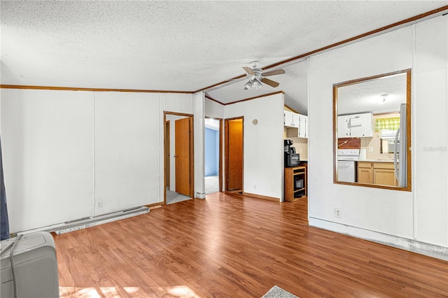 unfurnished living room featuring ceiling fan, crown molding, light hardwood / wood-style floors, vaulted ceiling, and a textured ceiling