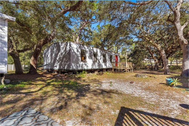 view of yard featuring a wooden deck