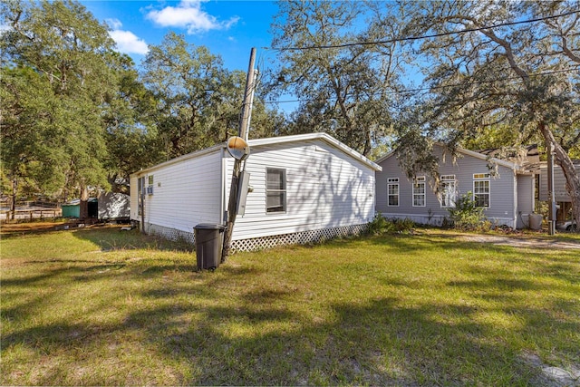 view of property exterior with a lawn