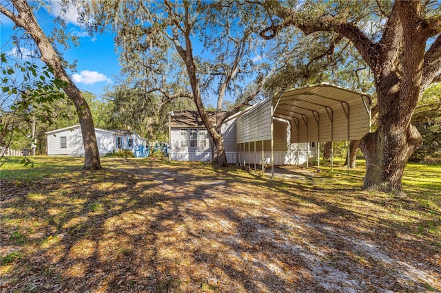 view of yard featuring a carport